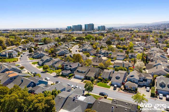 Aerial view of suburban homes with Khaki Brown HardiePlank siding and Arctic White trim in Foster City