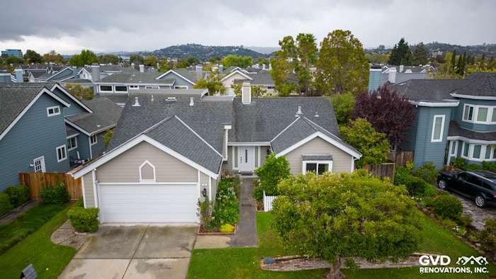 Home exterior with James Hardie CedarMill siding in Monterey Taupe and Milgard windows in Foster City, CA