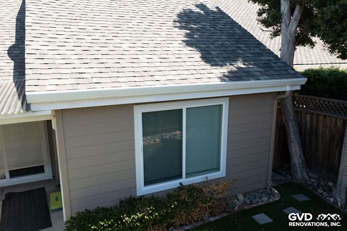 James Hardie Artisan Lap Siding in Khaki Brown with Arctic White trim and Simonton windows on home exterior