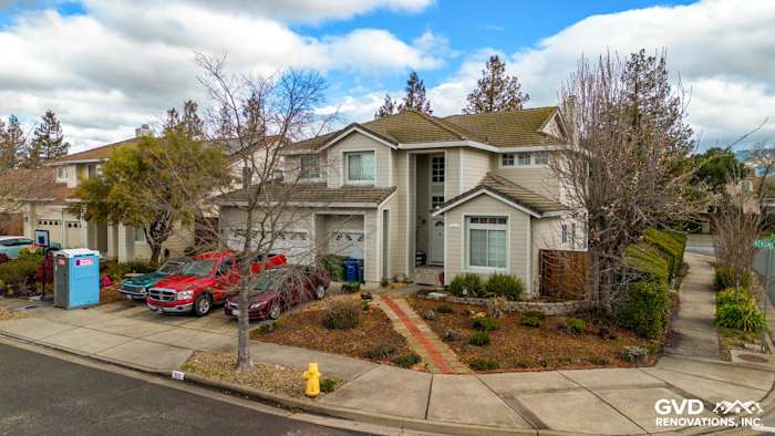 Petaluma home with newly installed James Hardie Cobble Stone siding and Arctic White trim, showcasing a complete exterior