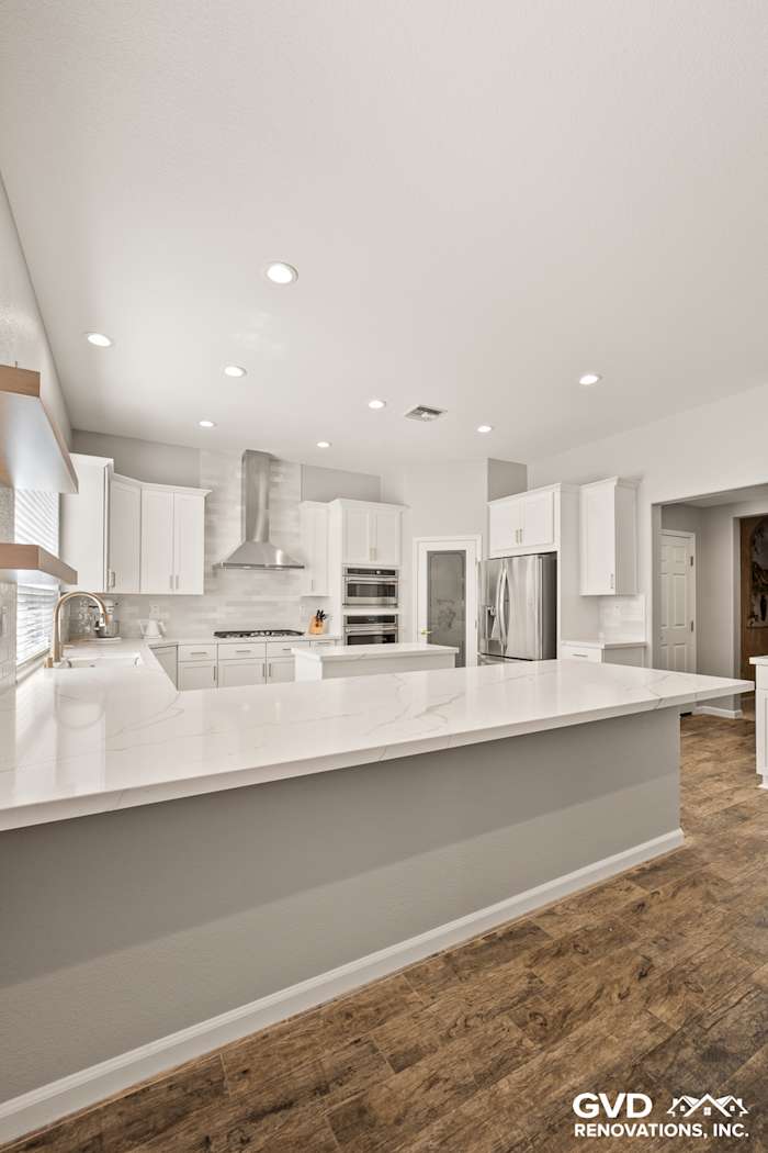 Modern kitchen in Roseville with Diamond cabinets, MSI countertops, floating shelves, and full-height backsplash