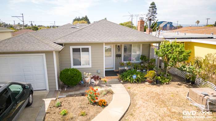 Home exterior featuring James Hardie siding in Monterey Taupe, Arctic White trim, and landscaped front yard in El Cerrito