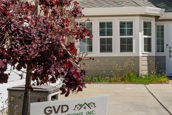 Home exterior featuring Monterey Taupe James Hardie lap siding and Arctic White trim in Foster City, CA