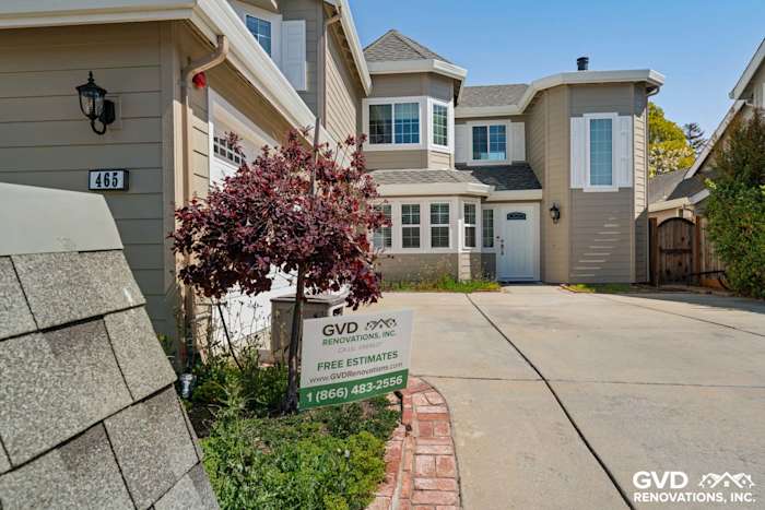 Home exterior featuring Monterey Taupe James Hardie lap siding and Arctic White trim in Foster City, CA