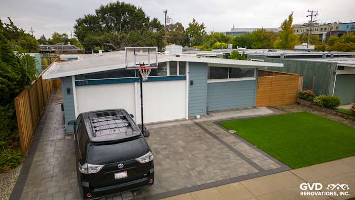 Modern home exterior featuring Boothbay Blue James Hardie siding and Arctic White trim in San Mateo