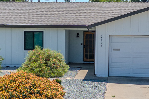 Modern single-story home exterior featuring James Hardie Board & Batten siding and Anlin windows in Arctic White