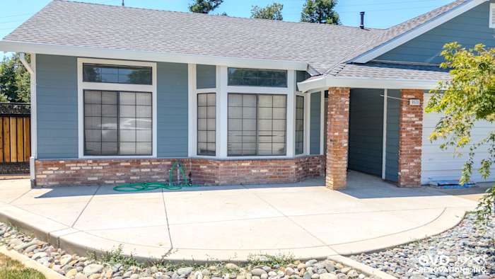 BoothBay Blue James Hardie siding with Arctic White trim on a modern Elk Grove home exterior