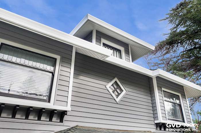 Gray vinyl siding renovation showcasing decorative diamond window detail and a modern architectural design in Dixon, CA