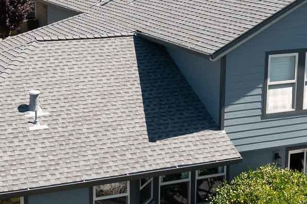 New Boothbay Blue James Hardie siding and Milgard windows enhancing a home exterior with landscaped patio in Rohnert Park