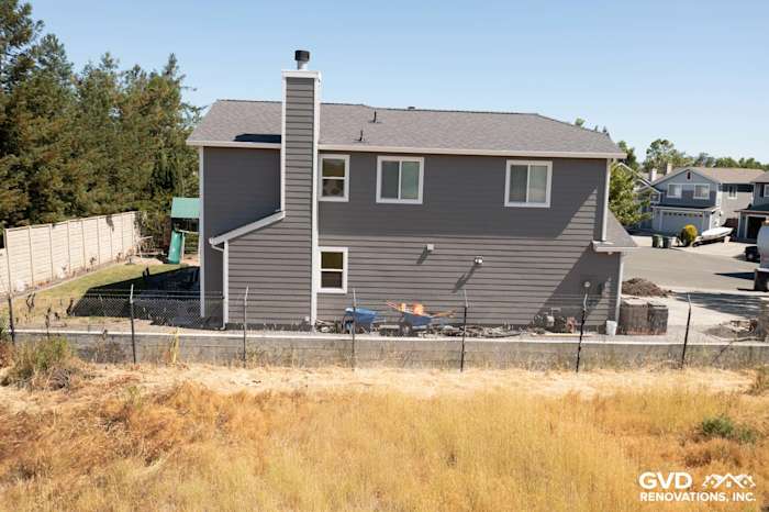 Rohnert Park home featuring James Hardie Aged Pewter siding with Arctic White trim, showcasing a stylish exterior renovation