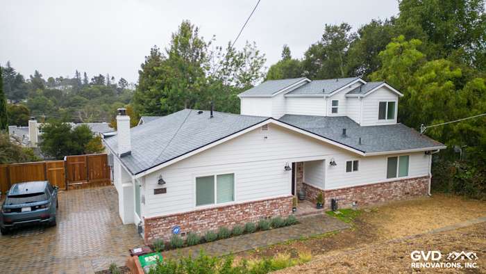 Oakland home exterior featuring James Hardie Cedarmill siding, HardieTrim, and Alside windows. Modern design details