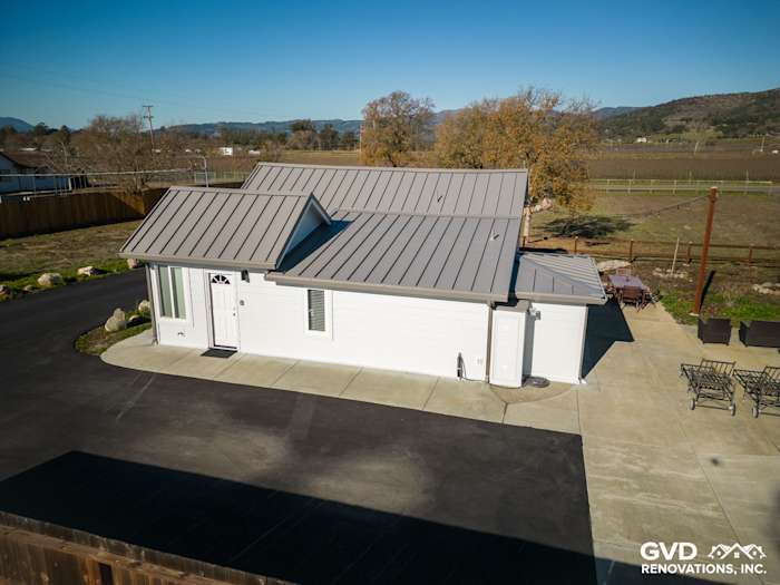 Home exterior featuring new James Hardie Arctic White siding and a modern metal roof in Sonoma, CA