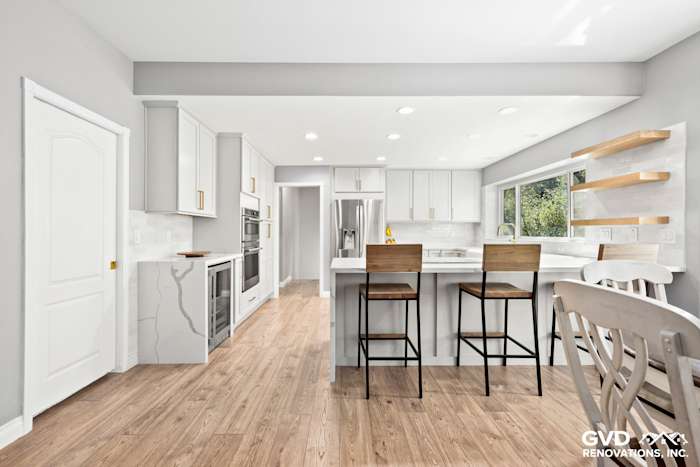 Modern kitchen in El Dorado Hills featuring custom cabinets, quartz countertops, and elegant bar seating