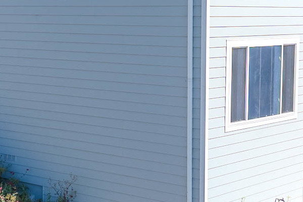 Light Mist James Hardie Lap Siding on a home exterior with Arctic White trim in Castro Valley, CA