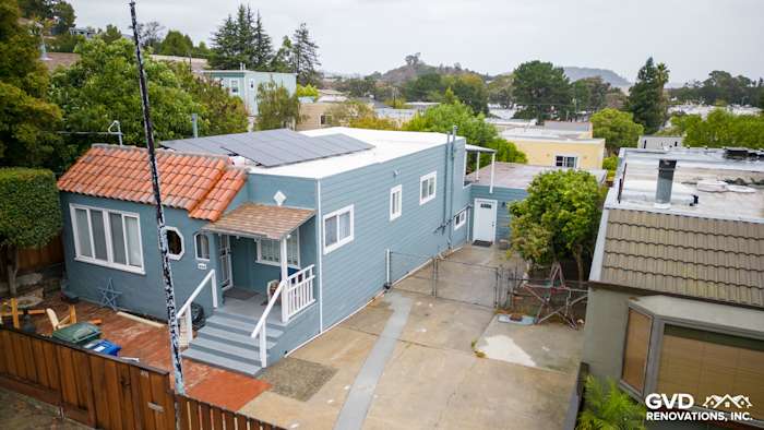 Brisbane home exterior featuring Boothbay Blue HardiePlank siding and Arctic White trim with solar panels on the roof