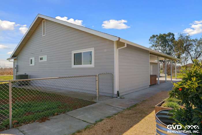 Side view of home featuring Pearl Gray James Hardie Siding and Arctic White trim in Galt, CA