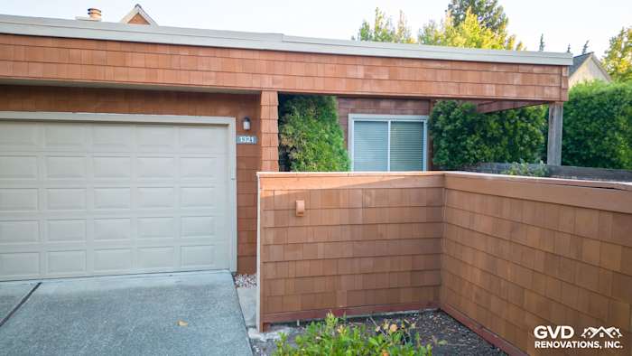 Cedar sidewall panel siding on home exterior with beige tones and updated Milgard windows in Sonoma
