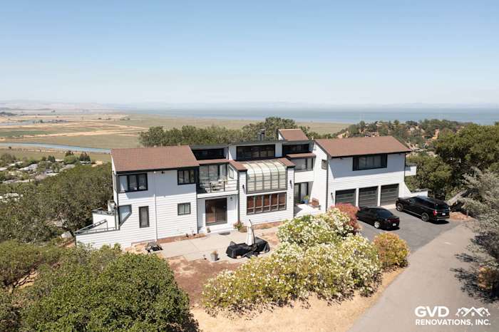 Modern home exterior with Arctic White James Hardie siding, multiple stories, and scenic waterfront view in San Rafael
