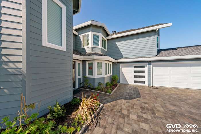 Boothbay Blue HardiePlank siding and Arctic White trim enhance this Foster City home's exterior