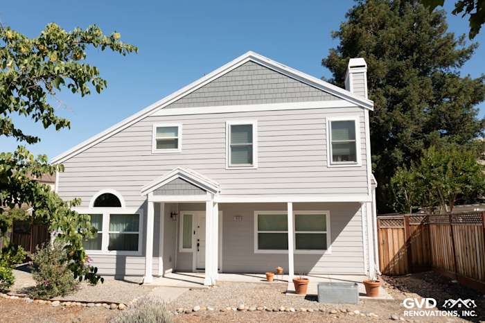 Home exterior in Petaluma featuring Pearl Gray James Hardie siding and Arctic White trim with new vinyl windows