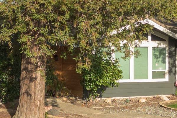 Modern home exterior featuring James Hardie Iron Gray siding and Arctic White trim in Rocklin, CA