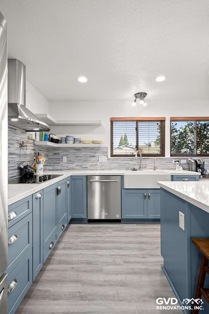Modern kitchen in Elk Grove featuring Waypoint cabinets, MSI Calacatta Ultra countertops, and Misty Fjord backsplash