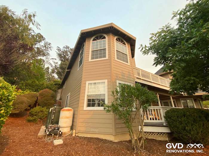 Khaki Brown HardiePlank siding on a unique two-story home in Petaluma, CA, featuring large windows and a landscaped yard