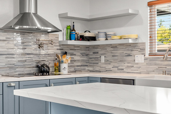 Modern kitchen remodel featuring Waypoint cabinets, MSI Calacatta Ultra countertops, and Misty Fjord backsplash in Elk Grove