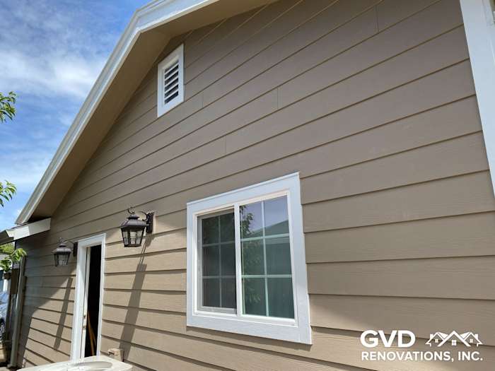 Khaki brown James Hardie lap siding with Arctic white trim on a residential home in Fairfield, CA