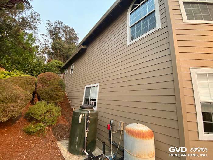 Khaki Brown James Hardie Lap Siding and Trim on a Petaluma home's exterior, featuring landscaping and utility components