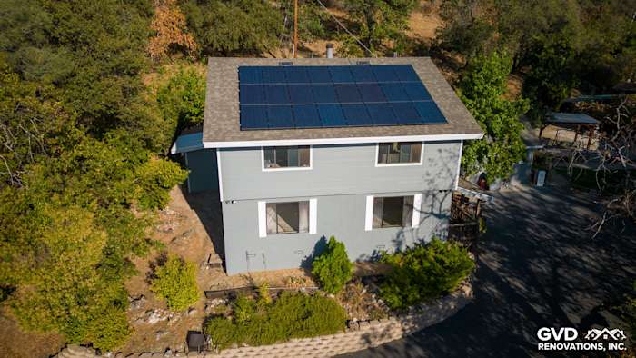 Colfax home featuring Gray Slate James Hardie lap siding, Arctic White trim, and solar panels on the roof