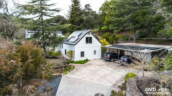 Modern home exterior showcasing James Hardie Arctic White siding, Marvin windows, and a carport in Sonoma, CA