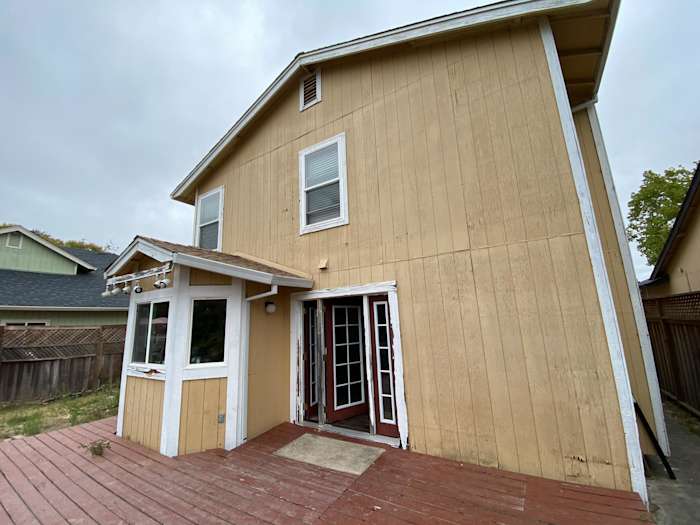 Newly installed James Hardie siding on a Santa Rosa home, featuring a unique design and deck area