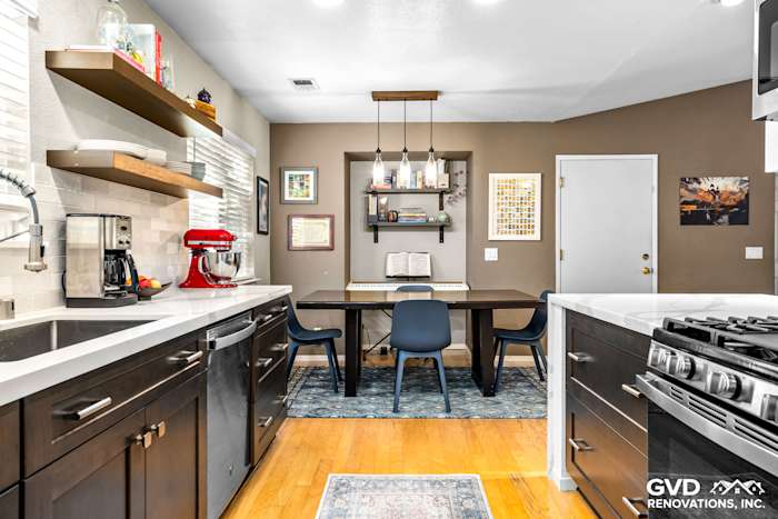 Modern kitchen remodel featuring dark cabinetry, white quartz countertops, and a stylish workspace in Davis, CA