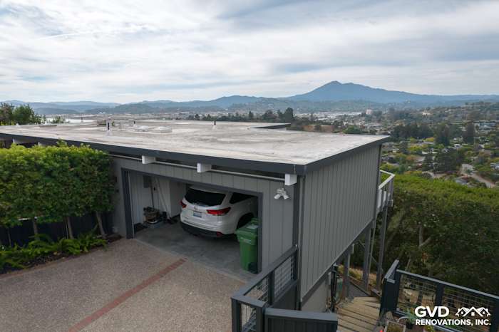 Modern home exterior featuring new T1-11 siding, garage, and stunning mountain views in San Rafael
