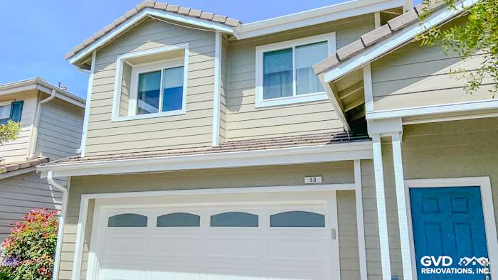 Richmond home exterior featuring James Hardie siding in Monterey Taupe and new Anlin windows, enhancing curb appeal
