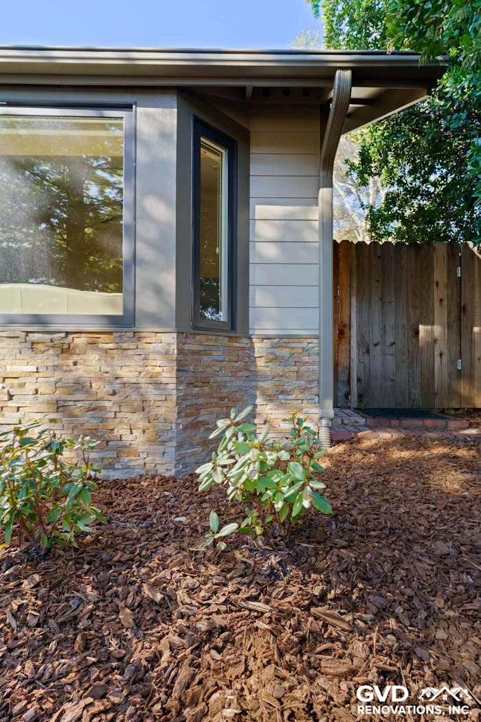 James Hardie siding with Eldorado stone base, landscaped with shrubs and mulch in Rescue, CA