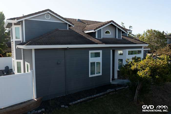 Home exterior featuring James Hardie Night Gray lap siding and white vinyl windows in Petaluma, CA