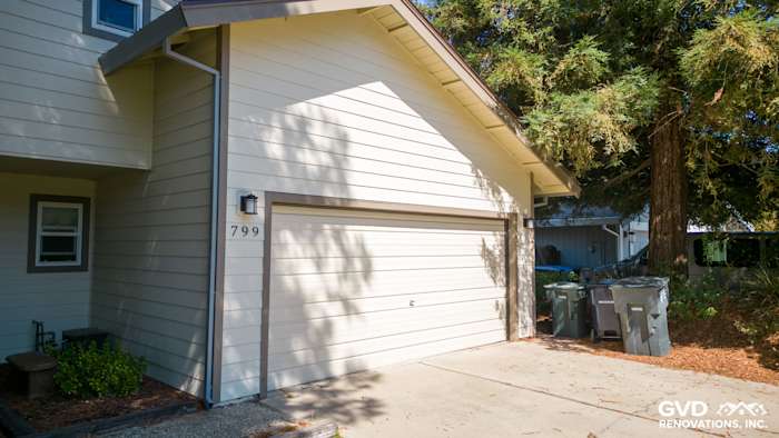 James Hardie plank siding and trim on home exterior with garage, light gray color in Sacramento
