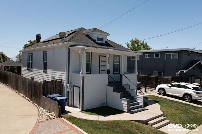 San Leandro home featuring James Hardie Arctic White lap siding and trim, showcasing a modern exterior makeover