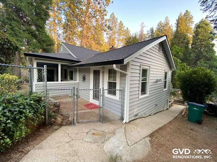 Home exterior featuring Prodigy Vinyl Siding in light gray, showcasing a remodeled entryway in Grass Valley