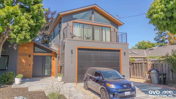 Modern home exterior featuring James Hardie V Groove Artisan Siding in gray with orange accents in San Jose