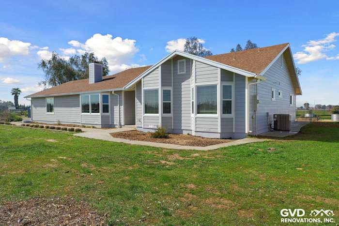 Home exterior showcasing Pearl Gray James Hardie siding and Arctic White trim with Anlin windows in Galt, CA