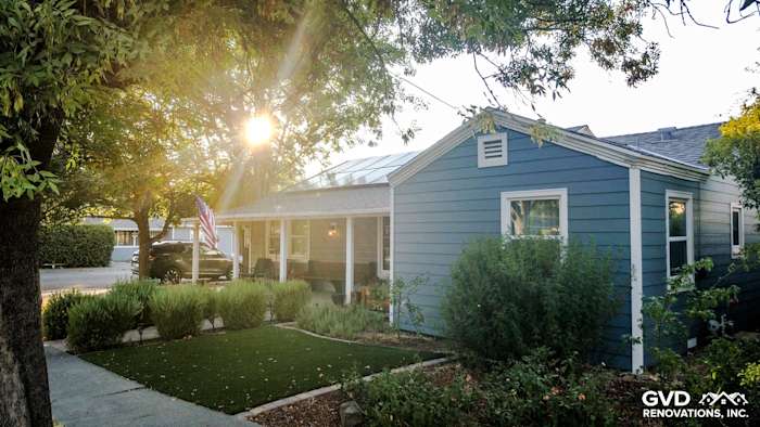 Coastal-style home in Winters, CA with Boothbay Blue HardiePlank siding and Arctic White trim, framed by greenery