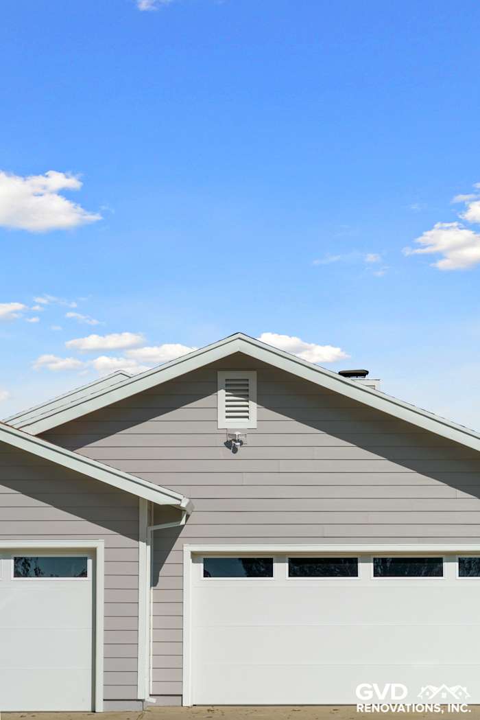 Pearl Gray James Hardie siding and Arctic White trim on home exterior in Galt, CA