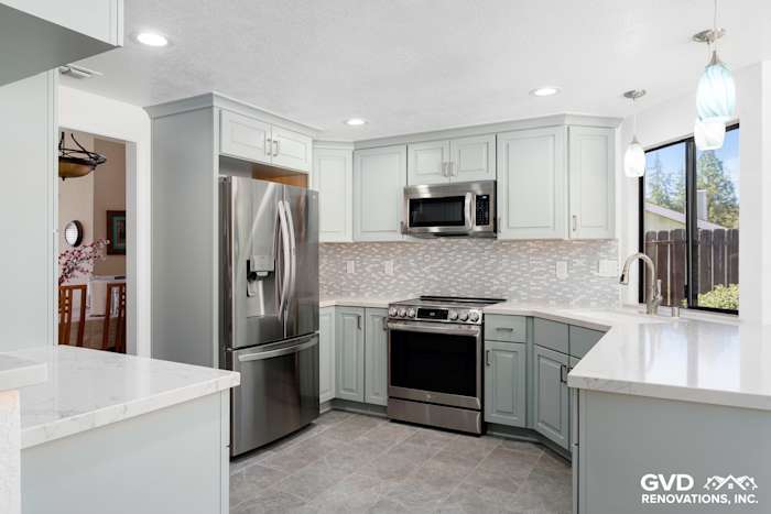 Modern kitchen remodel in Cameron Park featuring light blue cabinets, quartz countertops, and stainless steel appliances