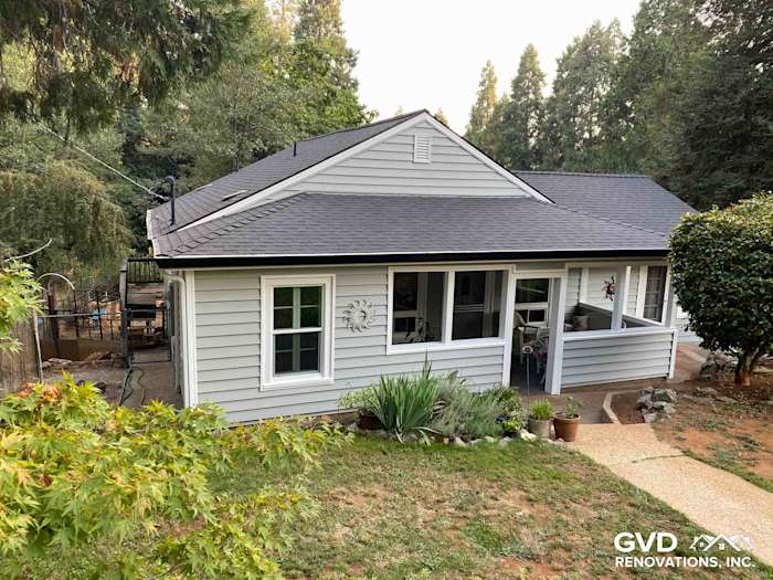 Gray Prodigy Vinyl Siding on a single-story home in Grass Valley with a landscaped front yard