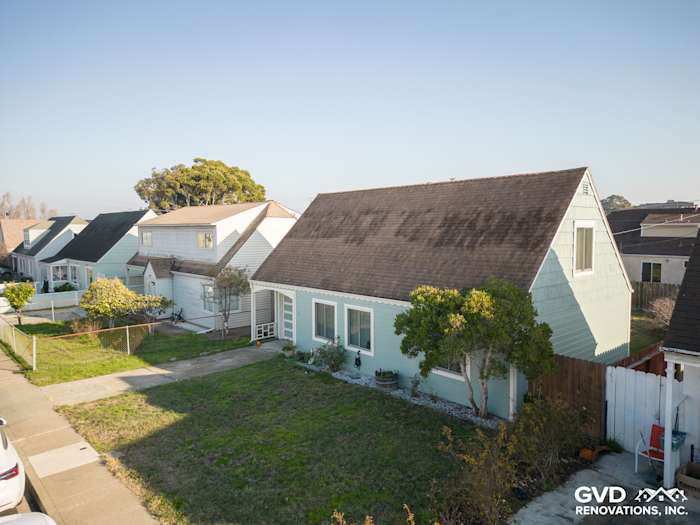 Exterior of a home featuring James Hardie Artisan Lap Siding in light blue with a modern design