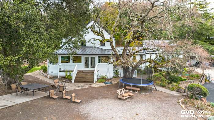 Home exterior featuring James Hardie Arctic White siding, new Marvin windows, and a landscaped yard in Sonoma, CA