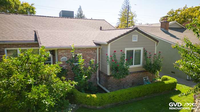 New Khaki Brown James Hardie siding enhances Sacramento home's exterior, complemented by vibrant landscaping
